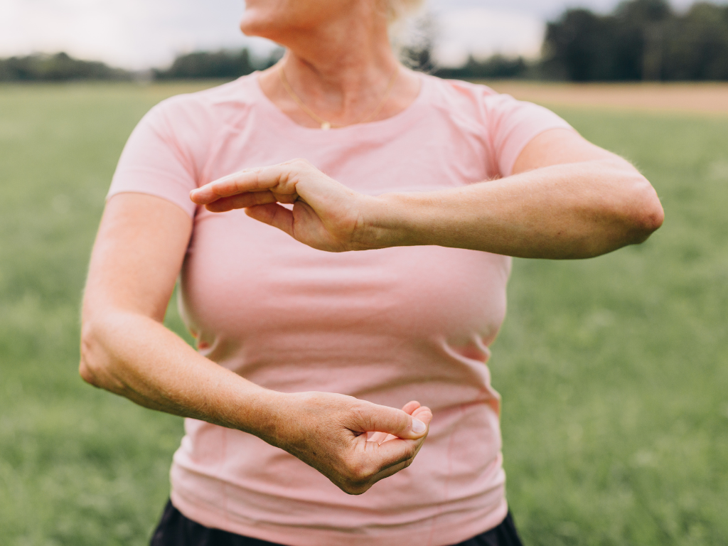 Woman doing yoga pose outside